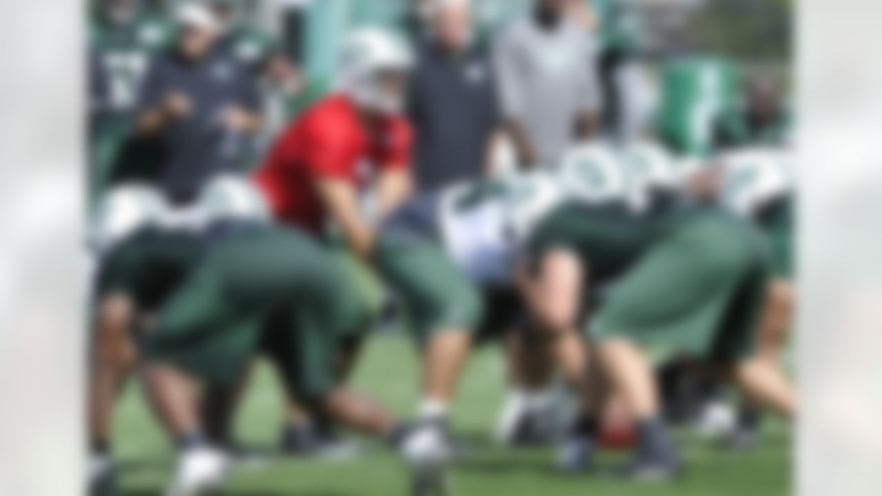 New York Jets quarterback Mark Sanchez takes a snap during practice on opening day of their NFL football training camp Friday, July 27, 2012, in Cortland, N.Y. (AP Photo/Bill Kostroun)