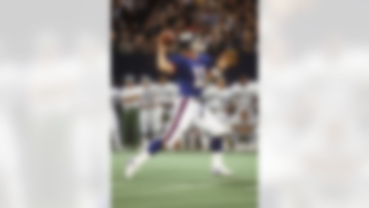 New York Giants quarterback Phil Simms (11) throws a pass during the NFL football game between the New York Jets and the New York Jets in East Rutherford, New Jersey on August 28, 1982. The Giants won the game 21-10. (AP Photo/Paul Spinelli)