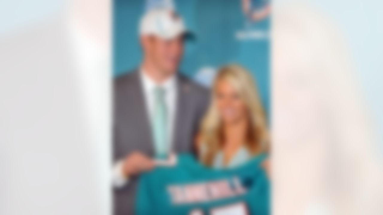April 28, 2012; Davie, FL, USA; Miami Dolphins first round draft pick quarterback Ryan Tannehill holds up a jersey next to his wife Lauren Ufer during a press conference at the Dolphins training facility. Mandatory Credit: Steve Mitchell-US PRESSWIRE