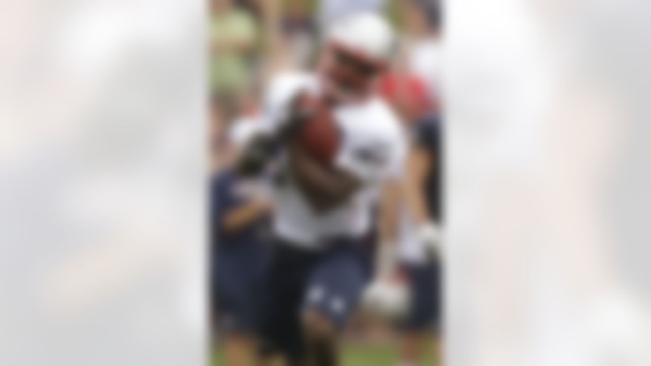 New England Patriots wide receiver Donte' Stallworth (19) runs after pulling in a pass during practice on the second day of training camp at the NFL football team's facility in Foxborough, Mass., Friday, July 27, 2012. (AP Photo/Stephan Savoia)