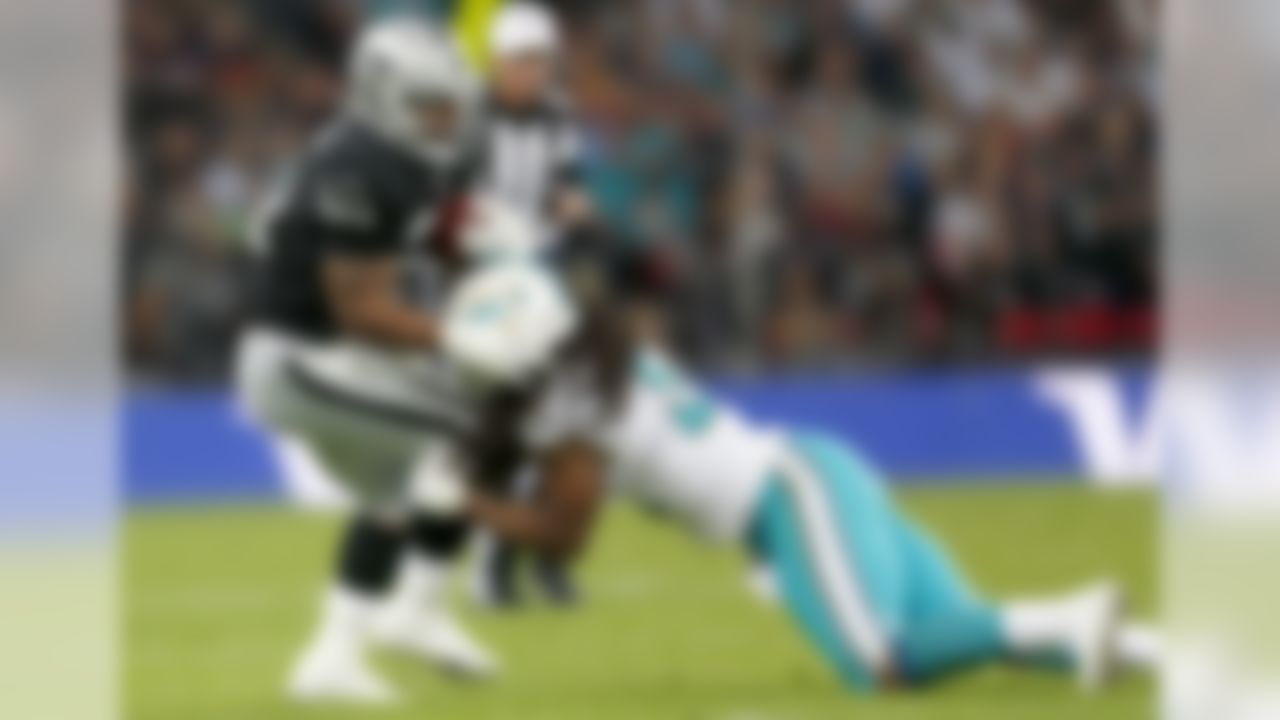 Oakland Raiders running back Maurice Jones-Drew (21) fights for extra yardage during an NFL football game against the Miami Dolphins at Wembley Stadium on Sunday, Sept. 28, 2014 in London, England. (Ben Liebenberg/NFL)