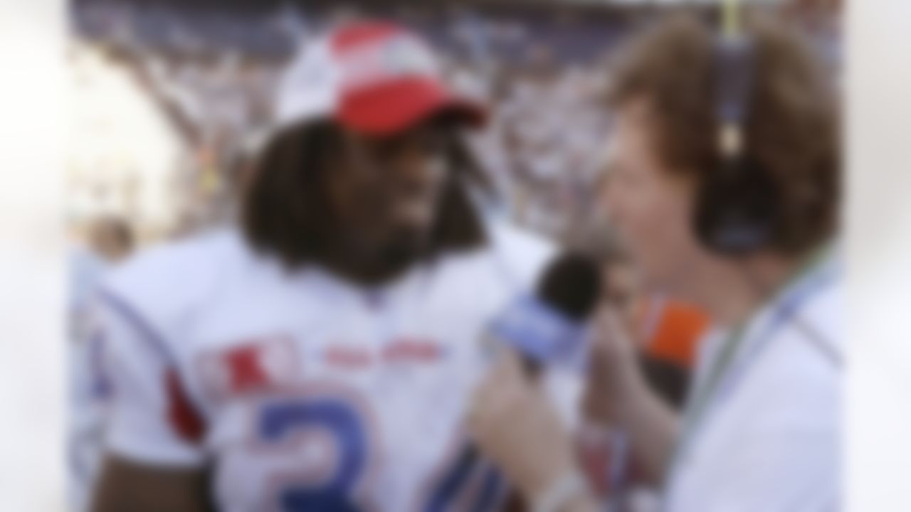 Running back Ricky Williams #34 of the Miami Dolphins talks to the media after the game and accepts the award as Most Valuable Player in the 2003 NFL Pro Bowl at Aloha Stadium in Honolulu, Hawaii on February 2, 2003. (AP Photo/Paul Spinelli)