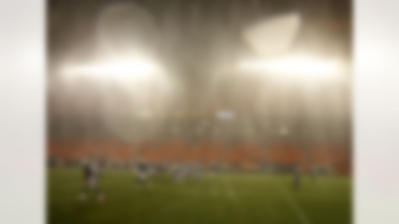 Atlanta Falcons and Miami Dolphins play in a driving rain during the second half of an NFL preseason football game, Friday, Aug. 24, 2012 in Miami. The Falcons defeated the Dolphins 23-6. (AP Photo/Wilfredo Lee)