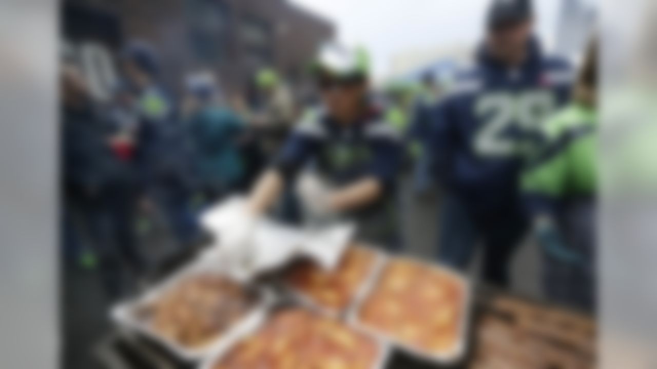 Fans tailgate before the NFL football NFC Championship game between the Green Bay Packers and the Seattle Seahawks Sunday, Jan. 18, 2015, in Seattle. (AP Photo/David J. Phillip)