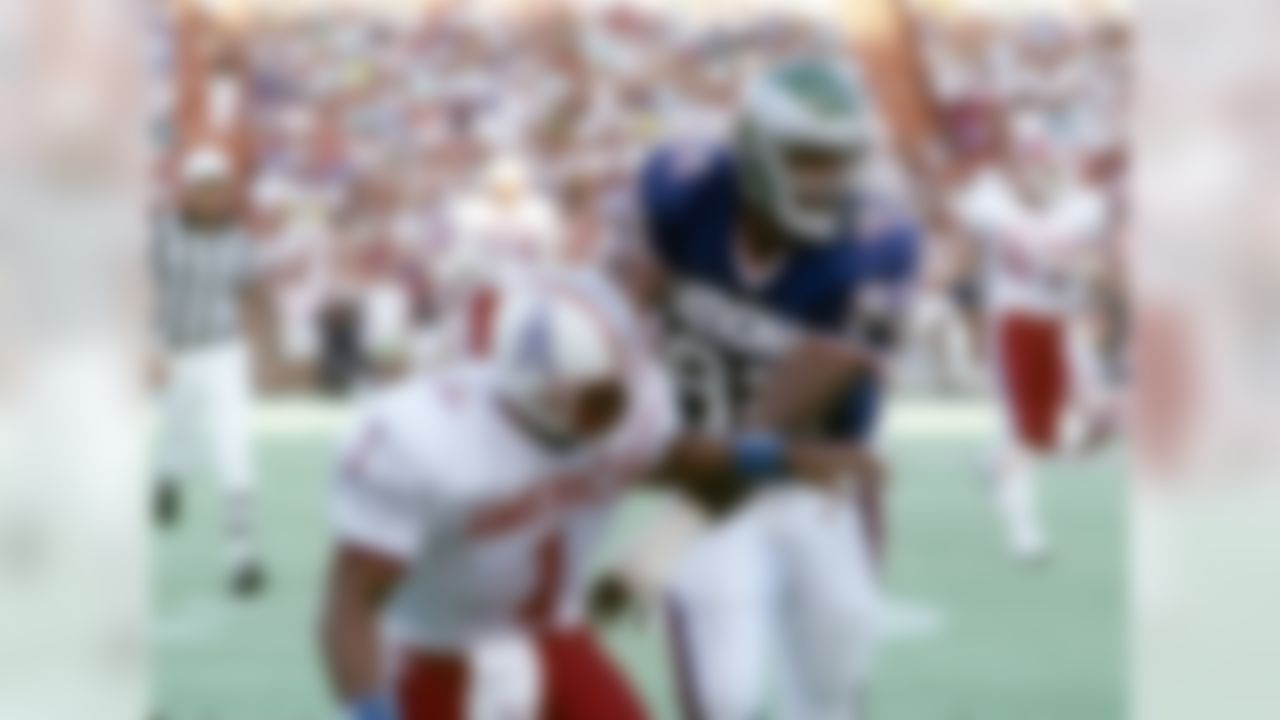 Philadelphia Eagles Hall of Fame defensive end Reggie White (92) hits Houston Oilers Hall of Fame quarterback Warren Moon (1) just after Moon releases the ball during the NFL Pro Bowl, a 34-3 NFC victory on January 29, 1989, at Aloha Stadium in Honolulu, Hawaii. (National Football League)