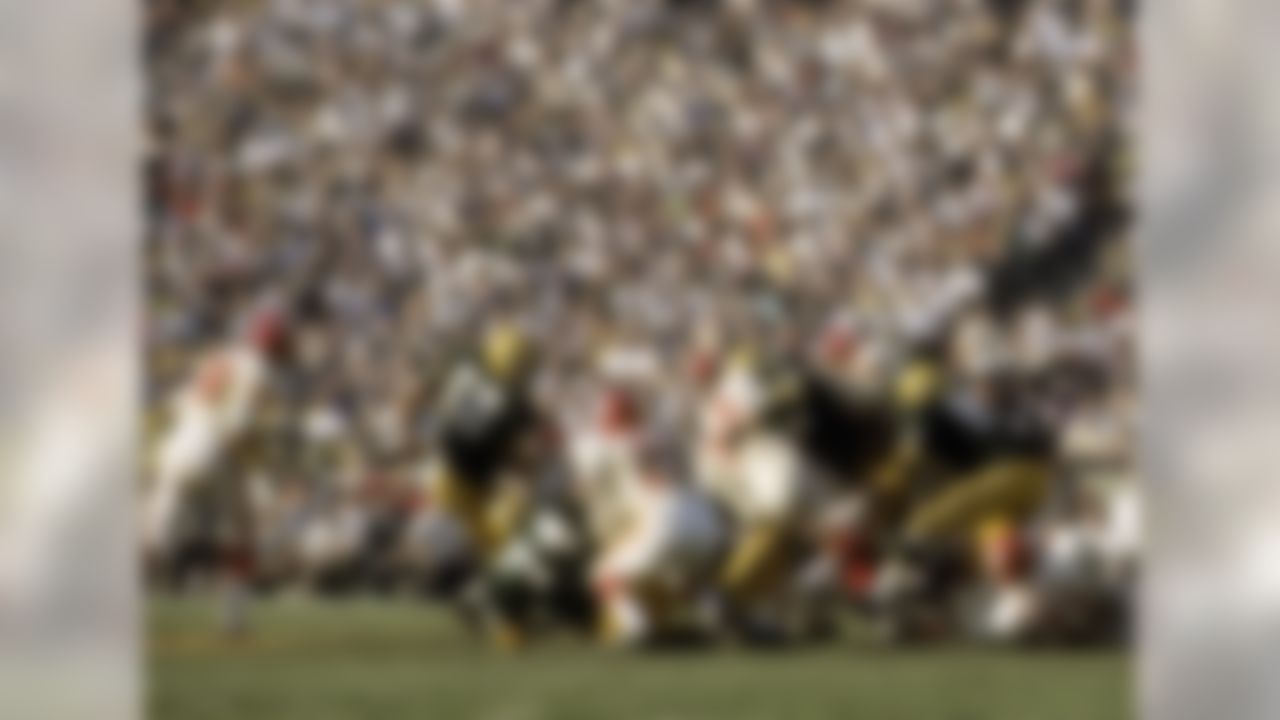 Green Bay Packers defensive tackle Ron Kostelnik (77) tackles Kansas City Chiefs running back Curtis McClinton (32) during Super Bowl I on January 15, 1967, at the Los Angeles Memorial Coliseum in Los Angeles, California. (National Football League)