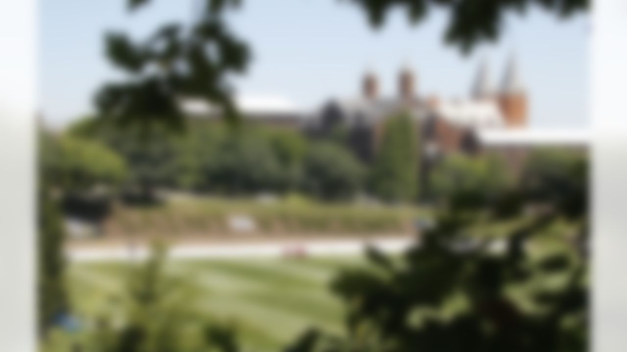 Steeples from the church on the campus of Saint Vincent College rise above the practice fields where the Pittsburgh Steelers arrived for NFL football training camp at the team's training facility in Latrobe, Pa., Wednesday, July 25, 2012. (AP Photo/Keith Srakocic)
