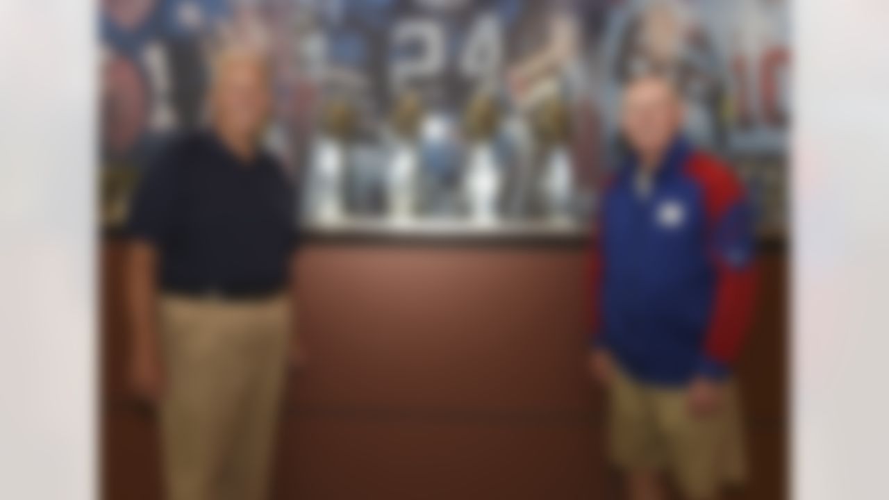New York Giants head coach Tom Coughlin and former head coach and Hall of Fame member Bill Parcells pose with the 4 Superbowl trophies they won following an OTA football practice at the Quest Diagnostics Training Center on June 10, 2013 in East Rutherford, NJ. (AP Photo/Evan Pinkus)