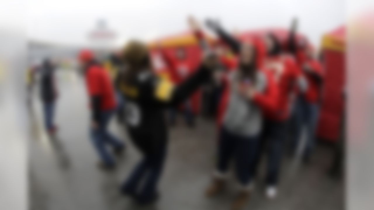 Fans tailgate before an NFL divisional playoff football game between the Kansas City Chiefs and the Pittsburgh Steelers, Sunday, Jan. 15, 2017, in Kansas City, Mo. (AP Photo/Charlie Riedel)