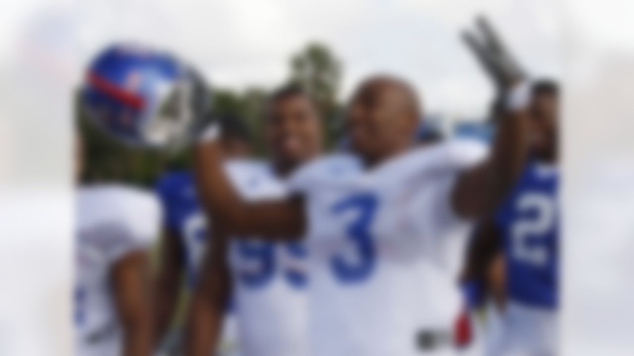 Kansas Jayhawks cornerback Aqib Talib (3) jokes with teammates before practice at Barry University in Miami Shores, Fla. on Dec. 28, 2007. Kansas will play Virginia Tech next Thursday in the Orange Bowl football game. Jamal Greene (99) watches in the background. (AP Photo/Terry Renna)