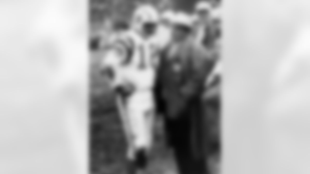 San Diego Chargers quarterback Tobin Rote (18) talks to Hall of Fame head coach Sid Gillman during the AFL Championship Game, a 20-7 loss to the Buffalo Bills on December 26, 1964, at War Memorial Stadium in Buffalo, New York. Rote retired after the game after 13 seasons. (Photo by Robert L. Smith/NFL)