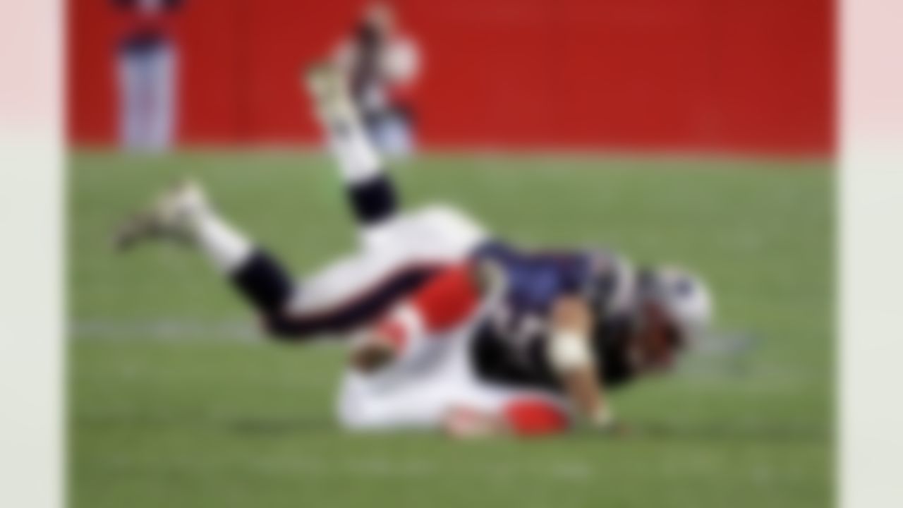 FOXBOROUGH, MA - OCTOBER 30: Linebacker Tedy Bruschi #54 of the New England Patriots finishes a tackle on Daimon Shelton #31 of the Buffalo Bills during their game on October 30, 2005 at Gillette Stadium in Foxborough, Massachusetts. The Patriots defeated the Bills 21-16. (Photo by Jim McIsaac/Getty Images)