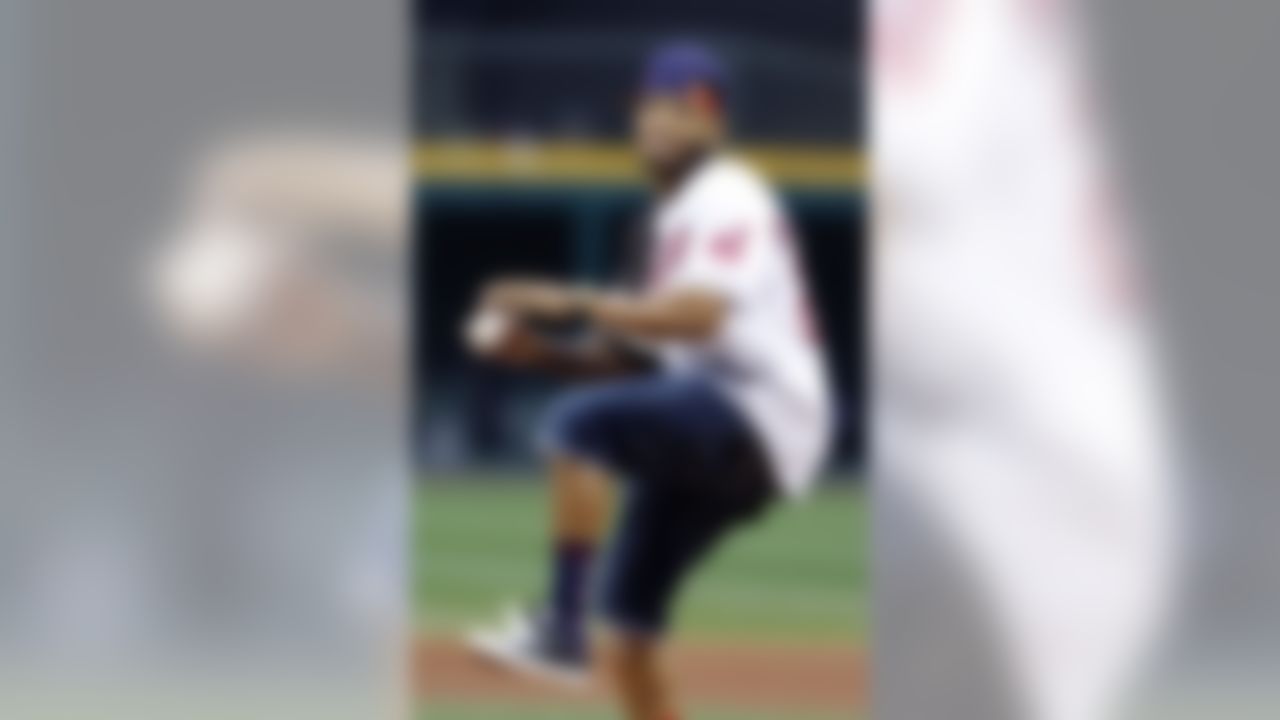 Cleveland Browns cornerback Joe Haden throws out a ceremonial pitch before a game between the Cleveland Indians and the Detroit Tigers in 2011, in Cleveland. (AP Photo/Mark Duncan)