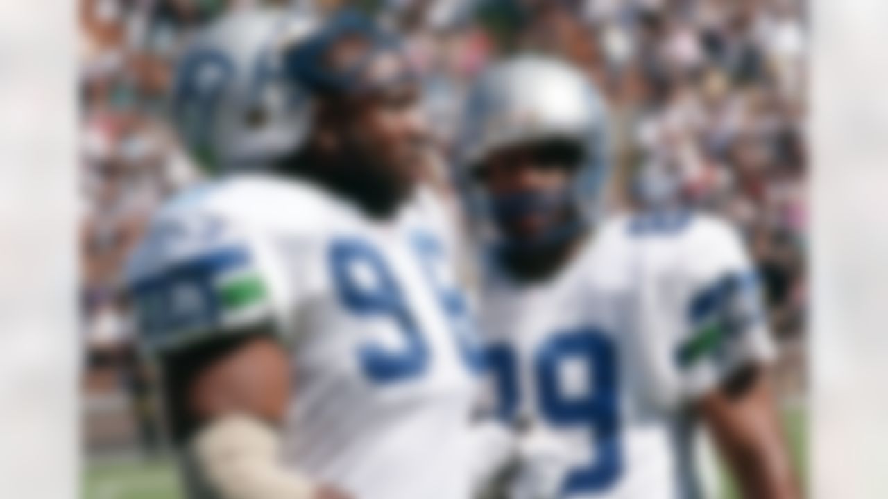 Seattle Seahawks defensive tackle defensive tackle Cortez Kennedy (96) and wide receiver Brian Blades (89) look on from the sideline during an NFL game against the Oakland Raiders Oct. 8, 1995, in Oakland, Calif.(Kevin Terrell via AP)