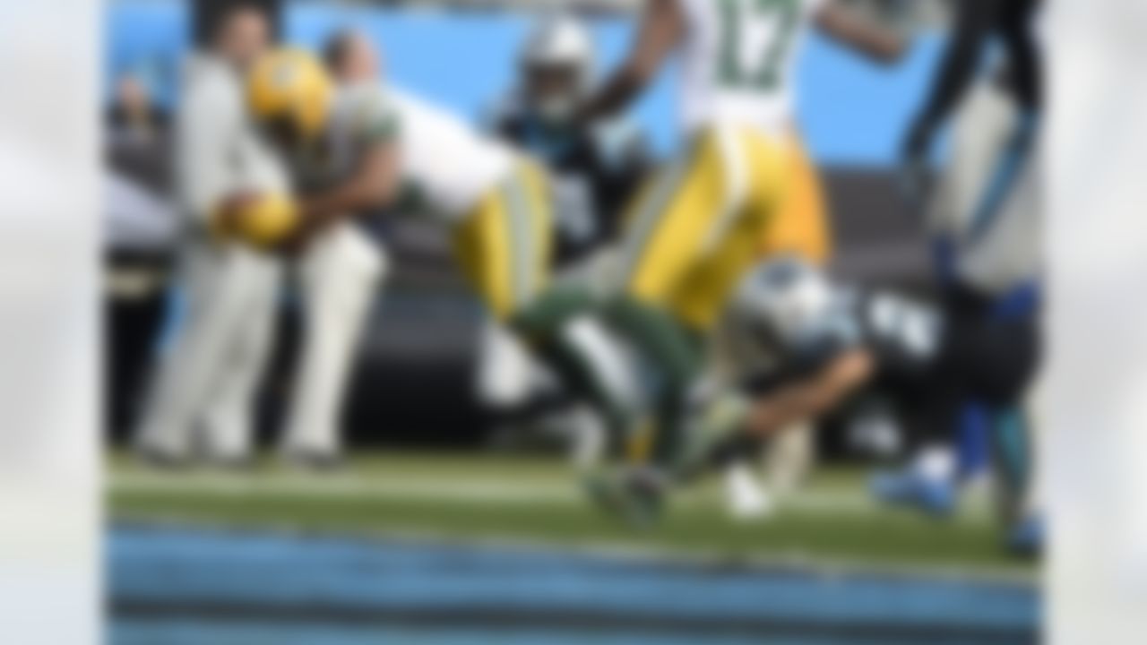 Green Bay Packers' Randall Cobb (18) dives over the goal line for a touchdown against the Carolina Panthers during the first half of an NFL football game in Charlotte, N.C., Sunday, Dec. 17, 2017.