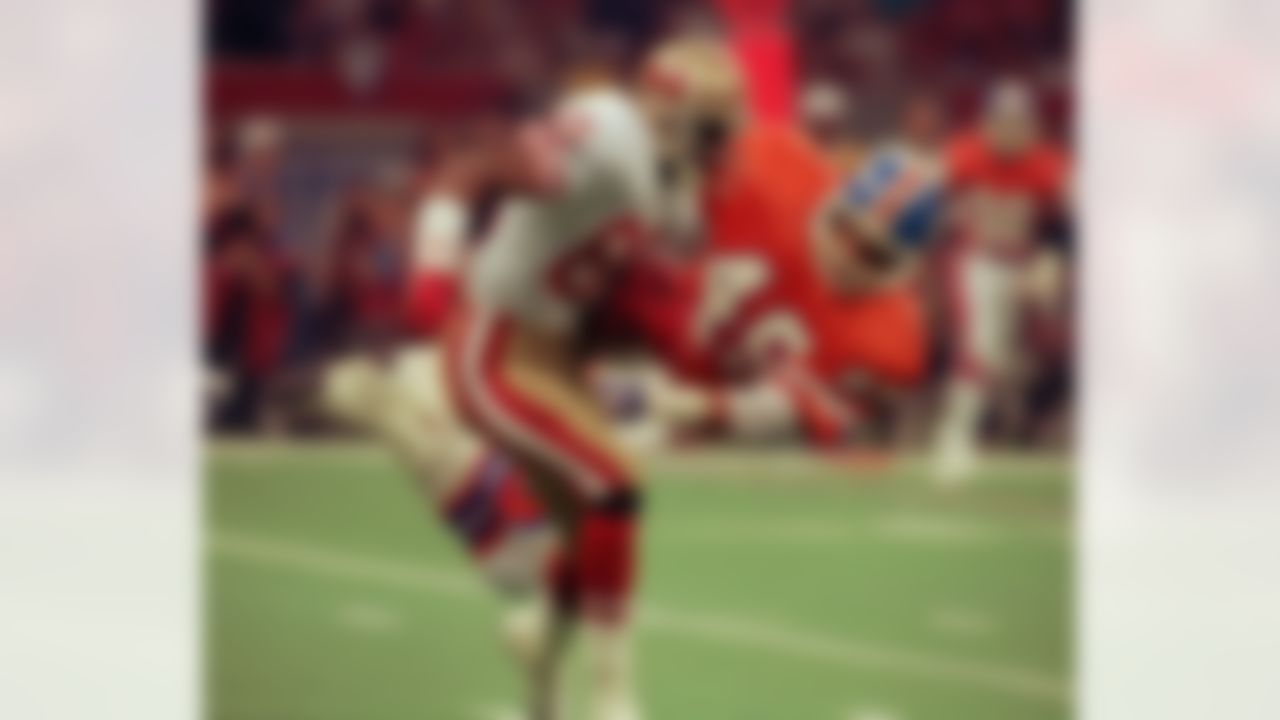 San Francisco 49ers wide receiver Jerry Rice shakes off Denver Broncos defender Dennis Smith during the 49ers 55 -10 victory in the Super Bowl XXIV in New Orleans, January 29, 1990. (AP Photo/Ed Reinke)