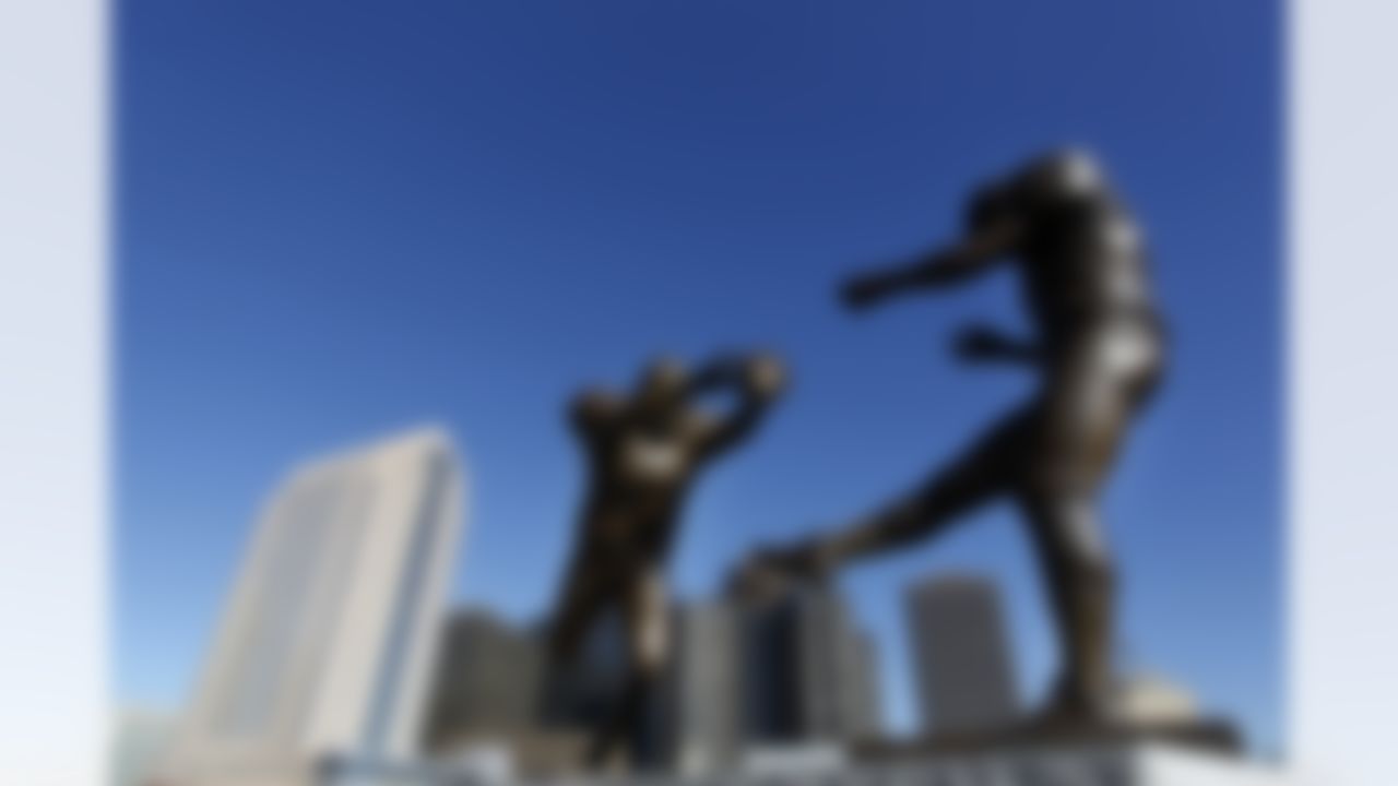 The bronze statue titled 'Rebirth,' which shows former New Orleans Saint Steve Gleason blocking a punt against the Atlanta Falcons during the first Monday Night Football game after the Superdome re-opened after Hurricane Katrina, is seen, outside the Mercedes-Benz Superdomein New Orleans, Thursday, Nov. 8, 2012. (AP Photo/Gerald Herbert)