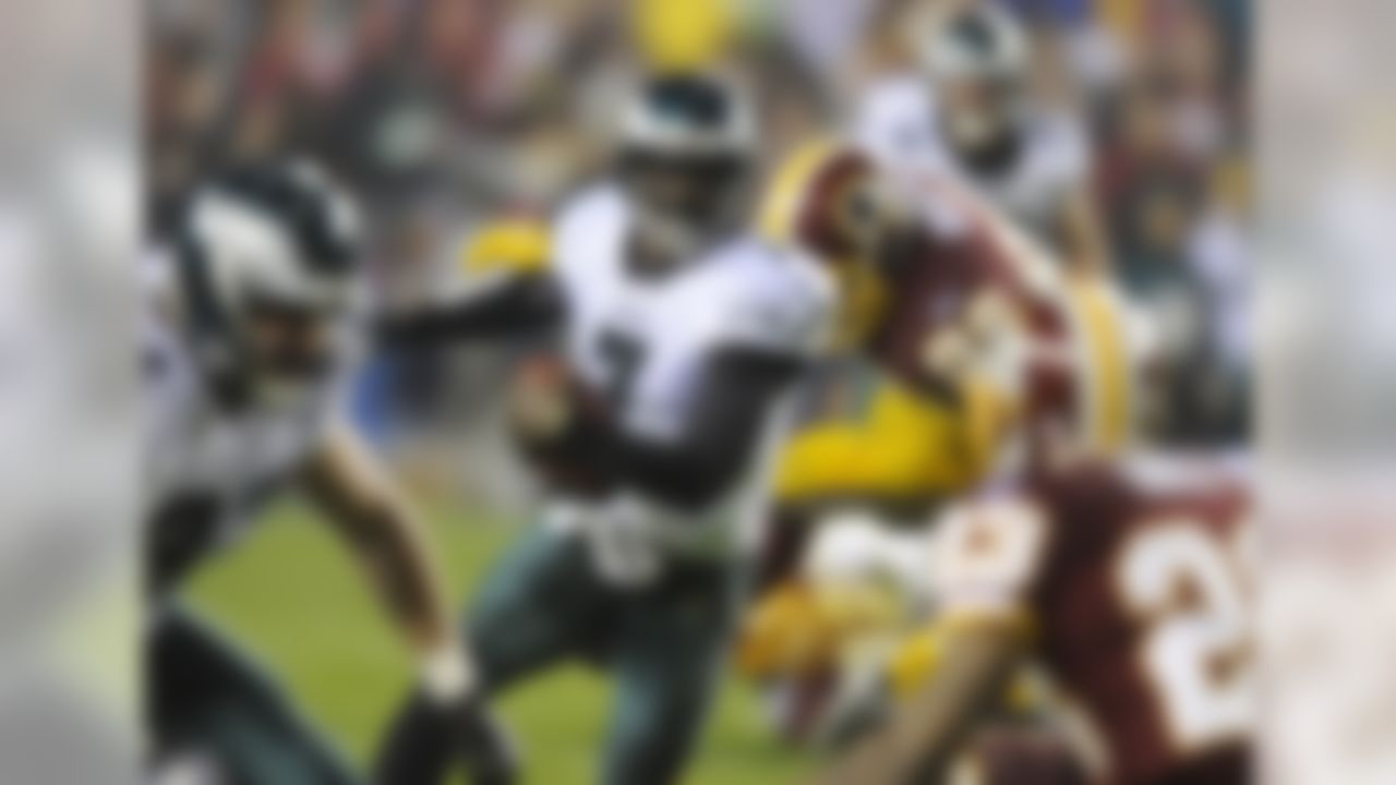 Philadelphia Eagles quarterback Michael Vick (7) rushes during the first half of an NFL football game against the Washington Redskins, Monday, Nov. 15, 2010, in Landover, Md. The Eagles won 59-28. (AP Photo/Nick Wass)