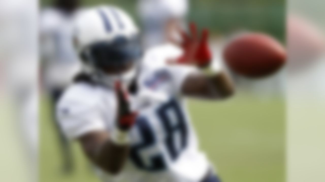 Tennessee Titans running back Chris Johnson (28) catches a pass during NFL football camp at Titans' headquarters Monday, July 30, 2012 Nashville, Tenn. (AP Photo/Wade Payne)