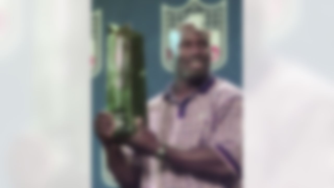 Denver Bronco running back Terrell Davis is all smiles as he holds the Super Bowl XXXII MVP award in San Diego on Monday, Jan. 26, 1998. Davis became the first player to capture the MVP award in his hometown. He did it with a flourish, rushing for a record three touchdowns and 157 yards. Imagine if he had played all four quarters. (AP Photo/Ed Andrieski)