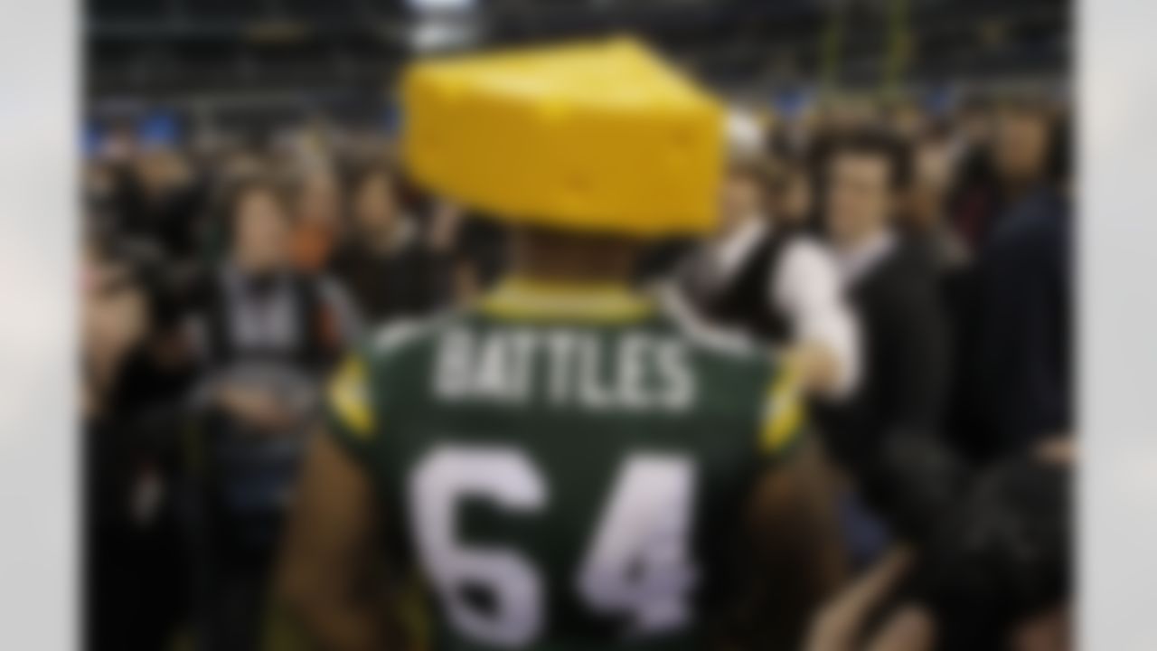 Green Bay Packers practice squad player Adrian Battles wears a Cheesehead as he answers a question during media day for NFL football Super Bowl XLV Tuesday, Feb. 1, 2011, in Arlington, Texas. (AP Photo/Eric Gay)