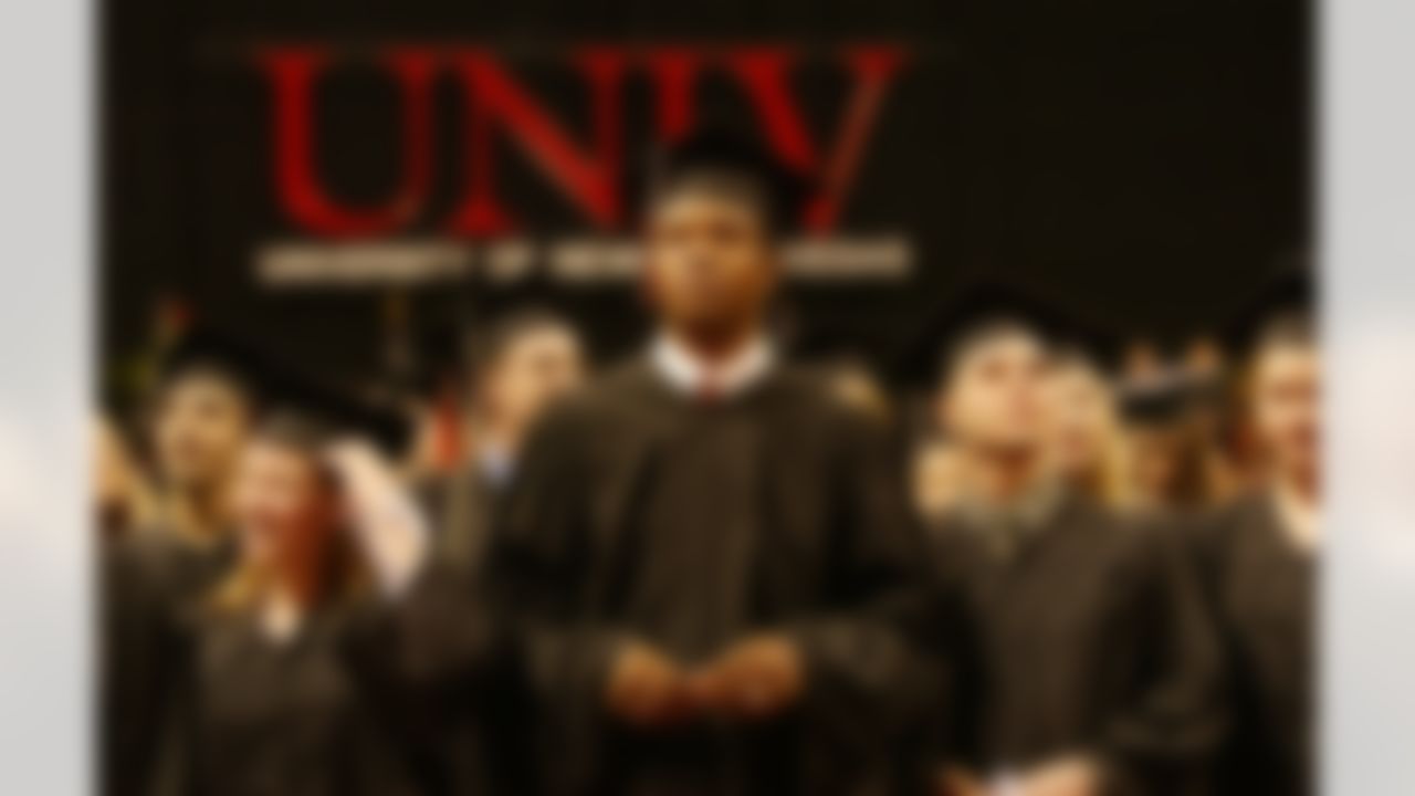 Randall Cunningham, who spent 16 seasons in the NFL as a quarterback with Philadephia, Minnesota, Baltimore, and Dallas, stands with other UNLV graduates at the Thomas & Mack Center in Las Vegas, Monday, Dec. 20, 2004. Cunningham was to recieve his bachelor's degree 20 years after leaving UNLV. (AP Photo/Joe Cavaretta)