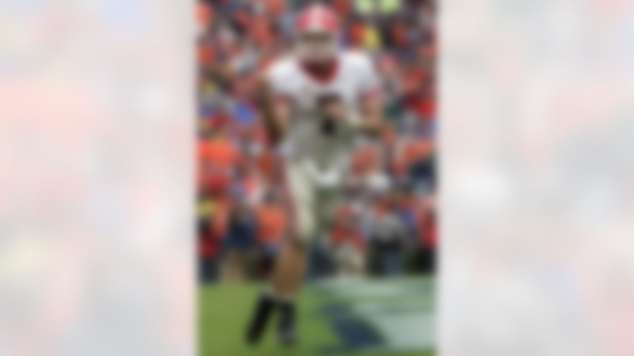 Georgia quarterback Matthew Stafford (7) celebrates his rushing touchdown against Auburn during the second half of a college football game, Saturday Nov. 11, 2006 in Auburn, Ala. Georgia won 37-15. (AP Photo/Todd Bennett)