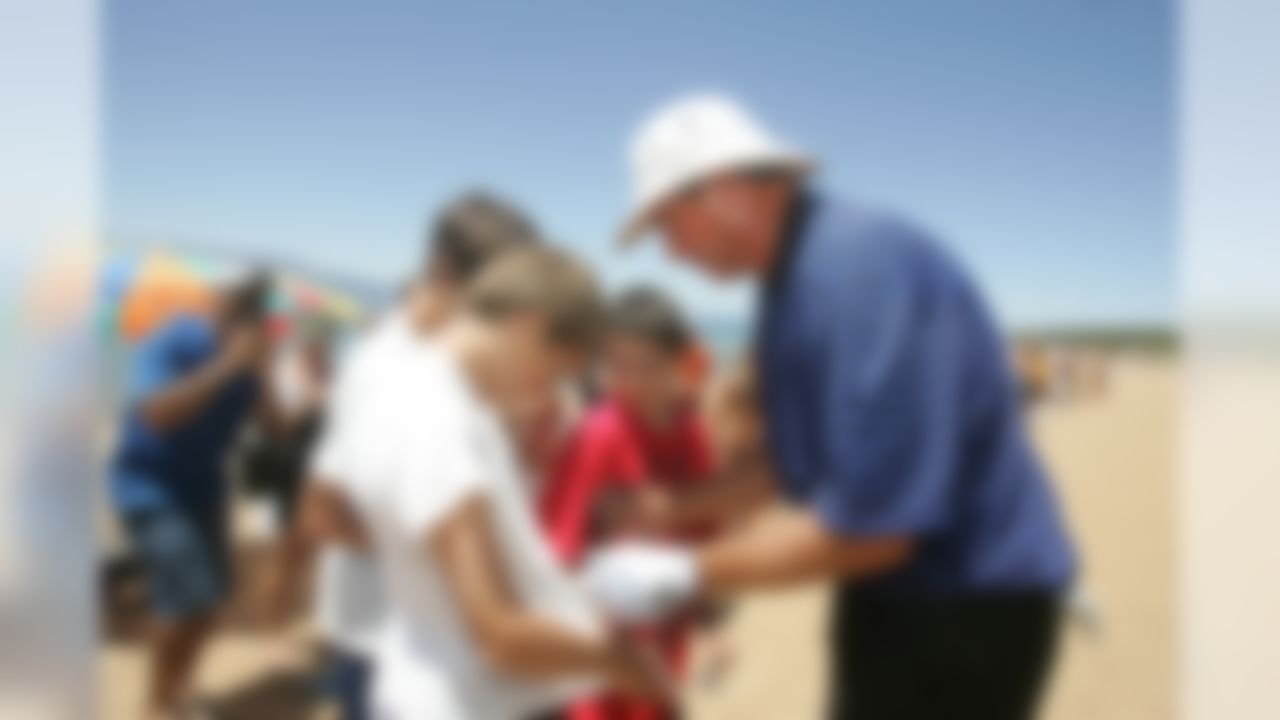 Dan Marino signs autographs during the American Century Golf Championship at Edgewood Tahoe Golf Course in Stateline, Nev., on Thursday, July 16, 2009. (AP Photo/Brad Horn)