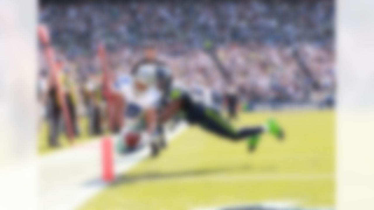 Dallas Cowboys wide receiver Miles Austin (19) dives for a touchdown against Seattle Seahawks cornerback Brandon Browner (39) during an NFL game in Seattle, Washington Sunday, Sept. 16, 2012. (AP Photo/Tom Hauck)