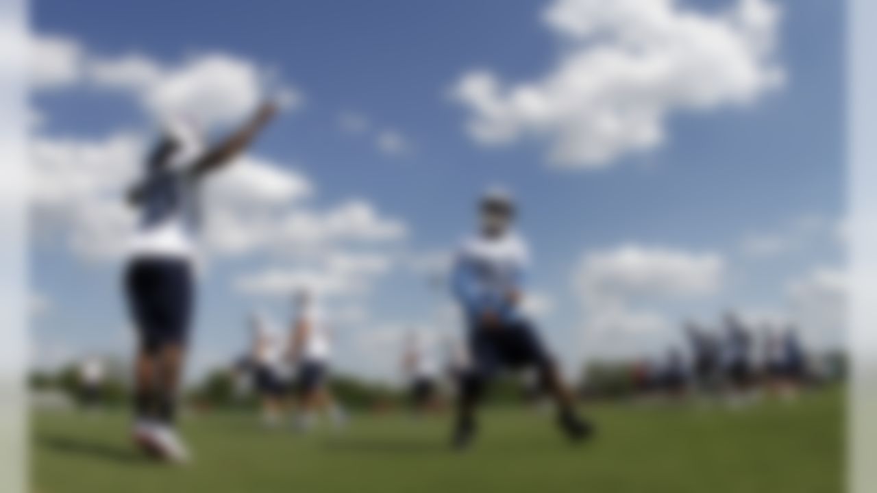 Tennessee Titans running back Nate Washington (85) and Chris Johnson (28) warm up during NFL football training camp on Saturday, July 28, 2012 Nashville, Tenn. (AP Photo/Wade Payne)