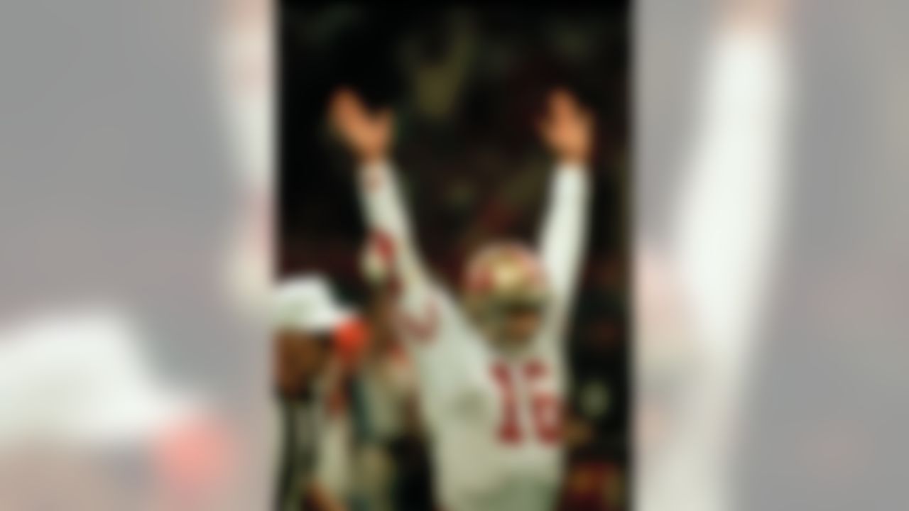 San Francisco 49er quarterback Joe Montana reacts after completing to Jerry Rice during the first period of their Super Bowl game with the Denver Broncos in New Orleans, January 28, 1990. (AP Photo/Red McLendon)