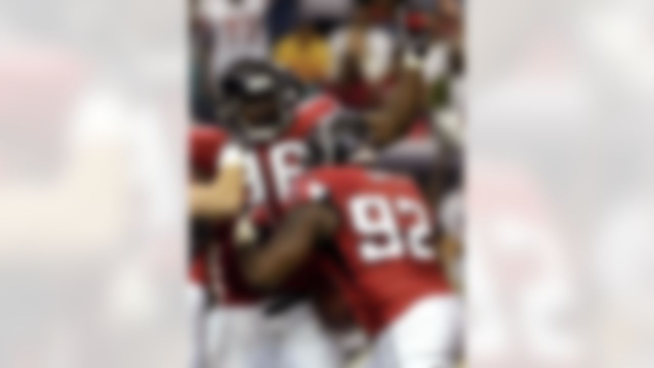 ATLANTA, GA - SEPTEMBER 30: Defensive end Chauncey Davis #92 of the Atlanta Falcons celebrates a fumble recovery with defensive tackle Montavious Stanley #96 against the Houston Texans at the Georgia Dome on September 30, 2007 in Atlanta, Georgia. The Falcons won 26 - 16. (Photo by Al Messerschmidt/Getty Images)