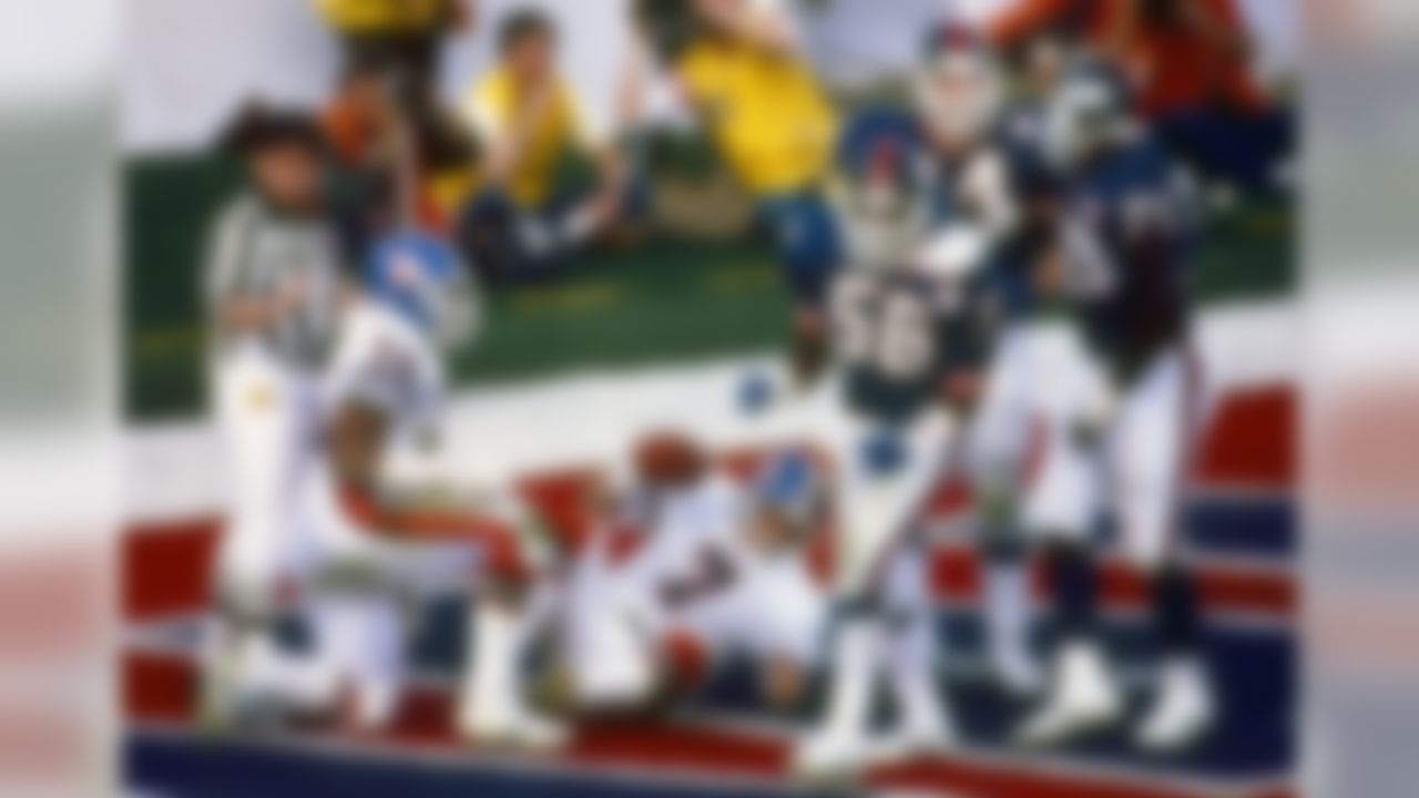Denver Hall of Fame quarterback John Elway is tackled for a safety as New York Giants Hall of Fame linebacker Lawrence Taylor and defensive tackle Leonard Marshall celebrate in the Broncos 39-20 loss to the Giants in Super Bowl XXI on January 25, 1987 at Rose Bowl. (National Football League)
