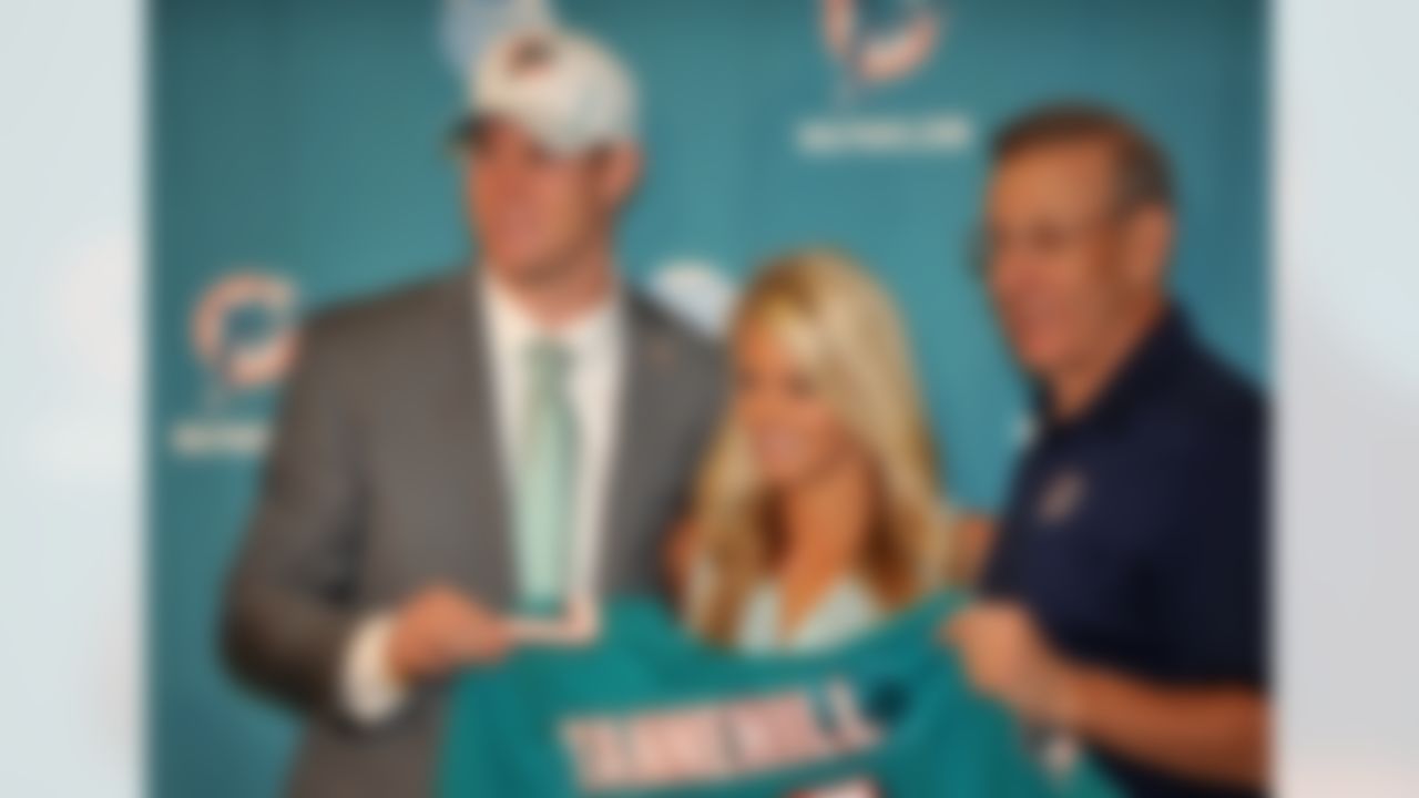 April 28, 2012; Davie, FL, USA; Miami Dolphins first round draft pick quarterback Ryan Tannehill (Texas A&M) holds up a jersey next to his wife Lauren Ufer and owner Stephen Ross during a press conference at the Dolphins training facility. Mandatory Credit: Steve Mitchell-US PRESSWIRE