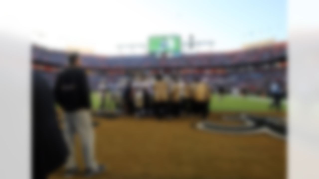The New Orleans Saints huddle on field prior to Super Bowl XLIV at Sun Life Stadium in Miami Gardens, Fla. on Feb. 7, 2010. (Ben Liebenberg/NFL.com)