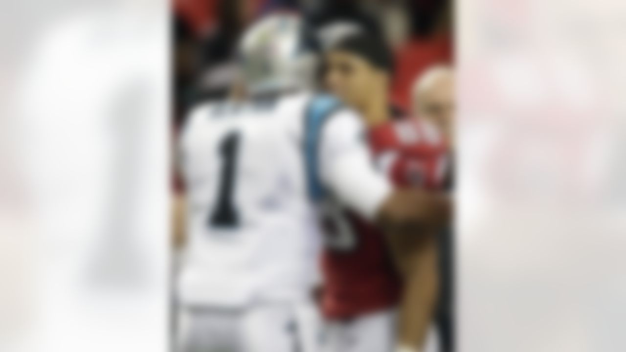 Atlanta Falcons tight end Tony Gonzalez (88) embraces Carolina Panthers quarterback Cam Newton (1) before the first half of an NFL football game, Sunday, Dec. 29, 2013, in Atlanta. (AP Photo/Dave Martin)