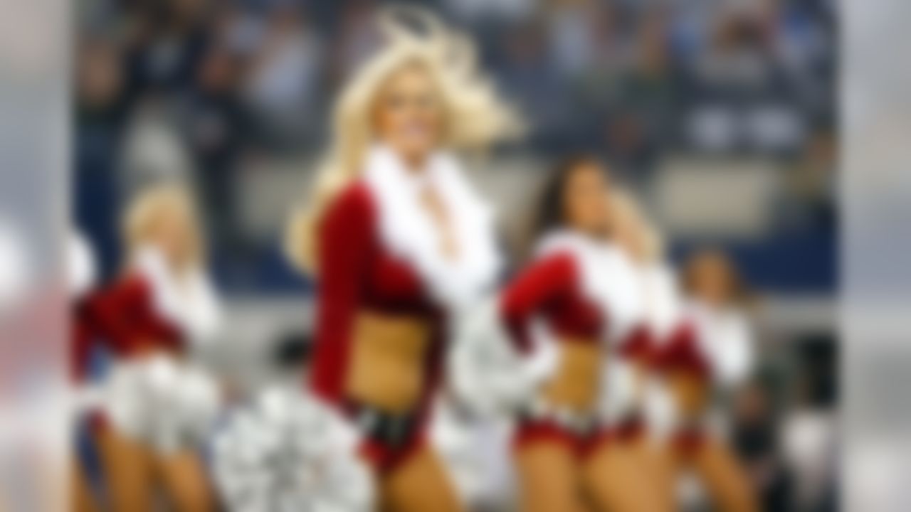 A Dallas Cowboys cheerleader during an NFL football game between the Green Bay Packers against the Dallas Cowboys at AT&T Stadium on Sunday December 15, 2013 in Arlington, Texas. (Aaron M. Sprecher/NFL)