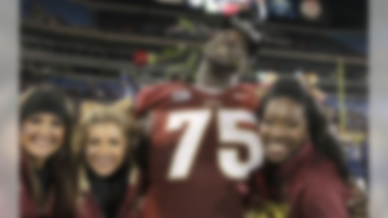 Florida State's Cameron Erving (75) celebrates after the Atlantic Coast Conference Championship NCAA football game in Charlotte, N.C., Saturday, Dec. 7, 2013. Florida State defeated Duke 45-7. (AP Photo/Bob Leverone)