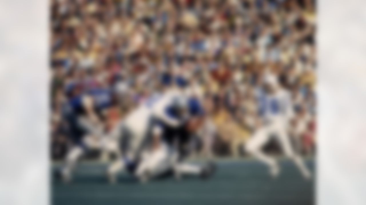 Dallas Cowboys running back Duane Thomas (33) carries the football and is stopped by Colts linebacker Mike Curtis (32) during the Cowboys 16-13 loss to the Baltimore Colts in Super Bowl V on January 17, 1971 at the Orange Bowl in Miami, Florida. (National Football League)
