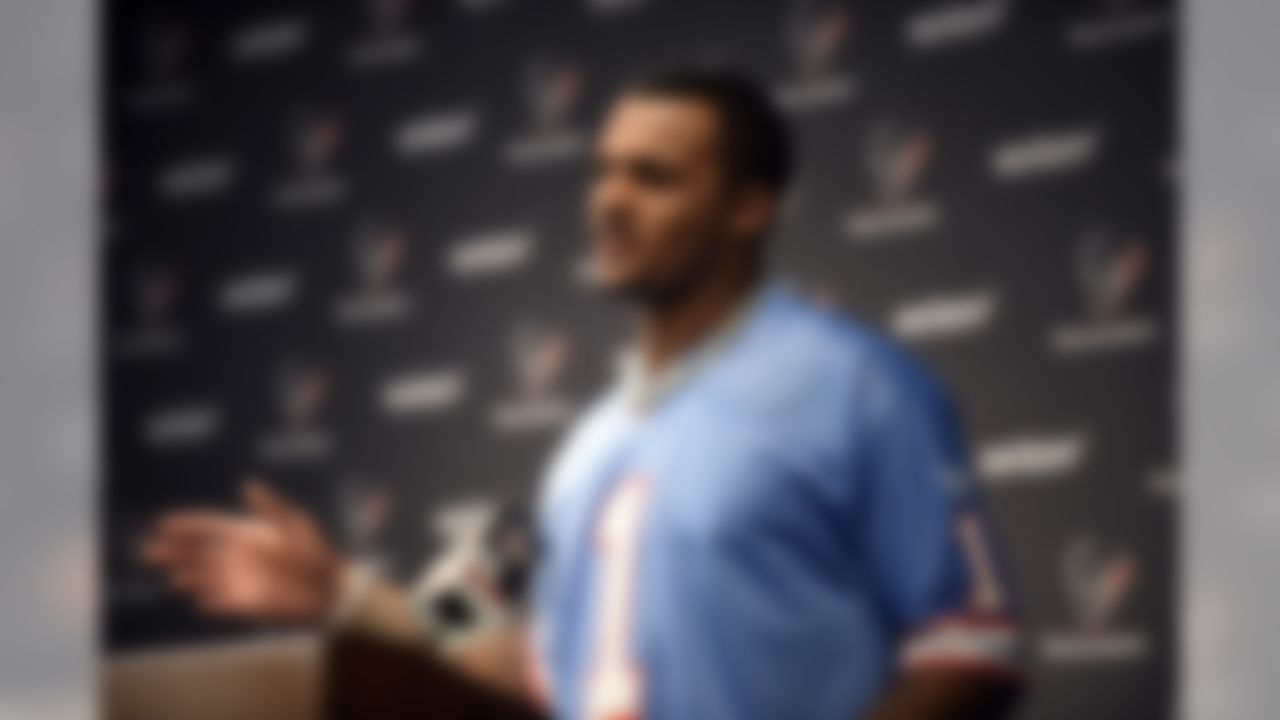 Houston Texans quarterback Deshaun Watson, wearing a Warren Moon Houston Oilers jersey, responds to a question during a news conference after an NFL football game against the Cleveland Browns on Sunday, Oct. 15, 2017, in Houston.