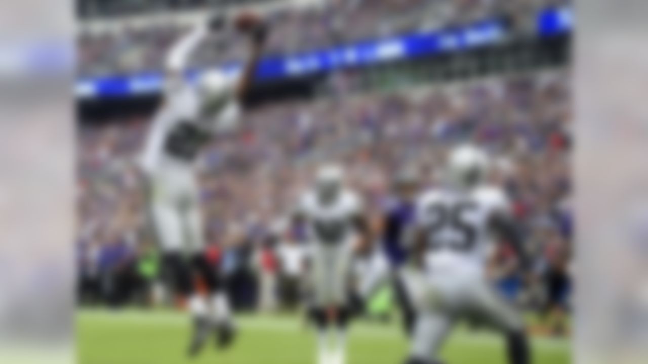 Oakland Raiders cornerback Sean Smith (21) intercepts a two-point conversion attempt in the end zone in the second half of an NFL football game against the Baltimore Ravens, Sunday, Oct. 2, 2016, in Baltimore. (AP Photo/Nick Wass)