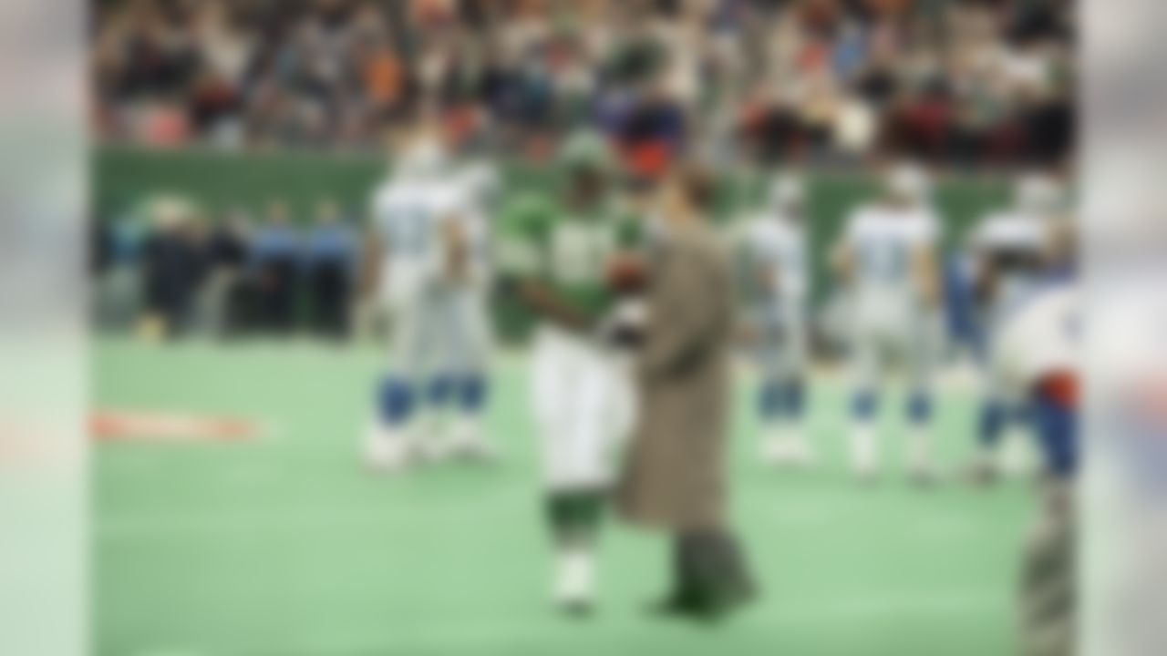 Former Seattle Seahawk Steve Largent, right, congratulates New York Jets wide receiver Art Monk, left, after Monk broke Largent�s record for consecutive games with a catch at Giants Stadium on Dec. 10, 1994 in East Rutherford, New Jersey. (AP Photo/Kevin Larkin)