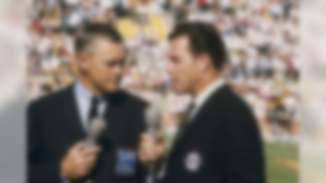 NBC announcer Paul Christman and CBS announcer Frank Gifford discuss Super Bowl I at the Los Angeles Memorial Coliseum on January 15, 1967. (National Football League)