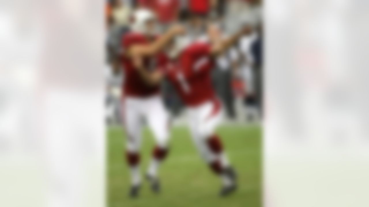 GLENDALE, AZ - SEPTEMBER 16: Kicker Neil Rackers #1 and holder Mike Barr #5 of the Arizona Cardinals celebrate after Rackers kicked the game winning field goal with four seconds left against the Seattle Seahawks at University of Phoenix Stadium September 16, 2007 in Glendale, Arizona. (Photo by Stephen Dunn/Getty Images)