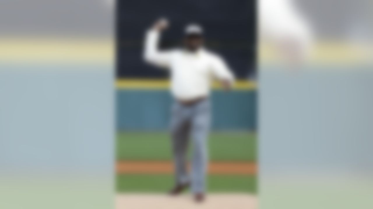 Retired Baltimore Ravens linebacker Ray Lewis throws the ceremonial first pitch before a baseball spring training exhibition game between the Detroit Tigers and the Pittsburgh Pirates, Saturday, March 2, 2013, in Lakeland, Fla. (AP Photo/Charlie Neibergall)