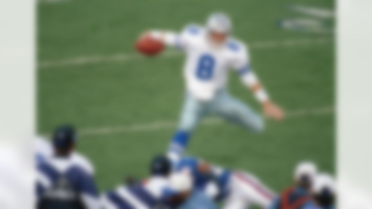 Dallas Cowboys quarterback Troy Aikman goes airborne for a second-quarter gain on Sunday, January 31, 1993 in Super Bowl action in Pasadena, California. The Cowboys won 52-17 against the Buffalo Bills.(AP Photo/ Reed Saxon)