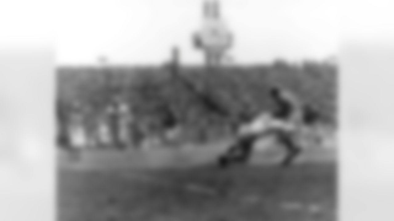 Philadelphia Eagles center-linebacker Chuck Bednarik, inducted into the Pro Football Hall of Fame class of 1967, nails the ballcarrier during a 23-21 loss to the Los Angeles Rams on November 27, 1955, at Connie Mack Stadium in Philadelphia, Pennsylvania. (National Football League)