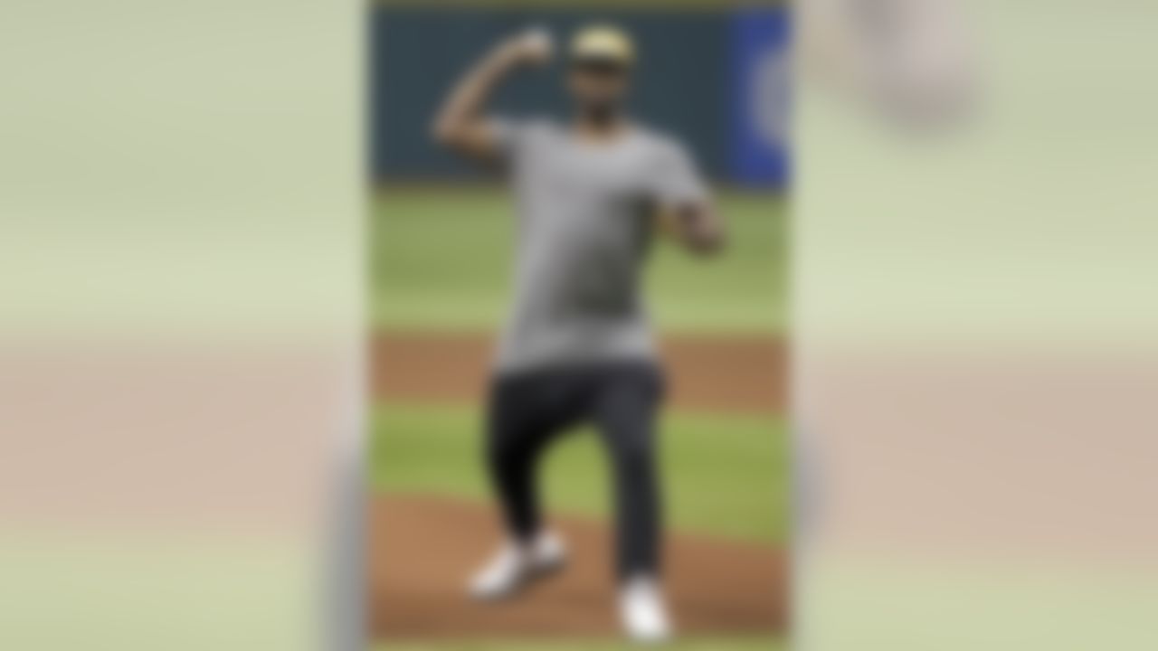 New Tampa Bay Buccaneers cornerback Darrelle Revis throws out the ceremonial first pitch before a baseball game between the Tampa Bay Rays and the New York Yankees Monday, April 22, 2013, in St. Petersburg, Fla. (AP Photo/Chris O'Meara)