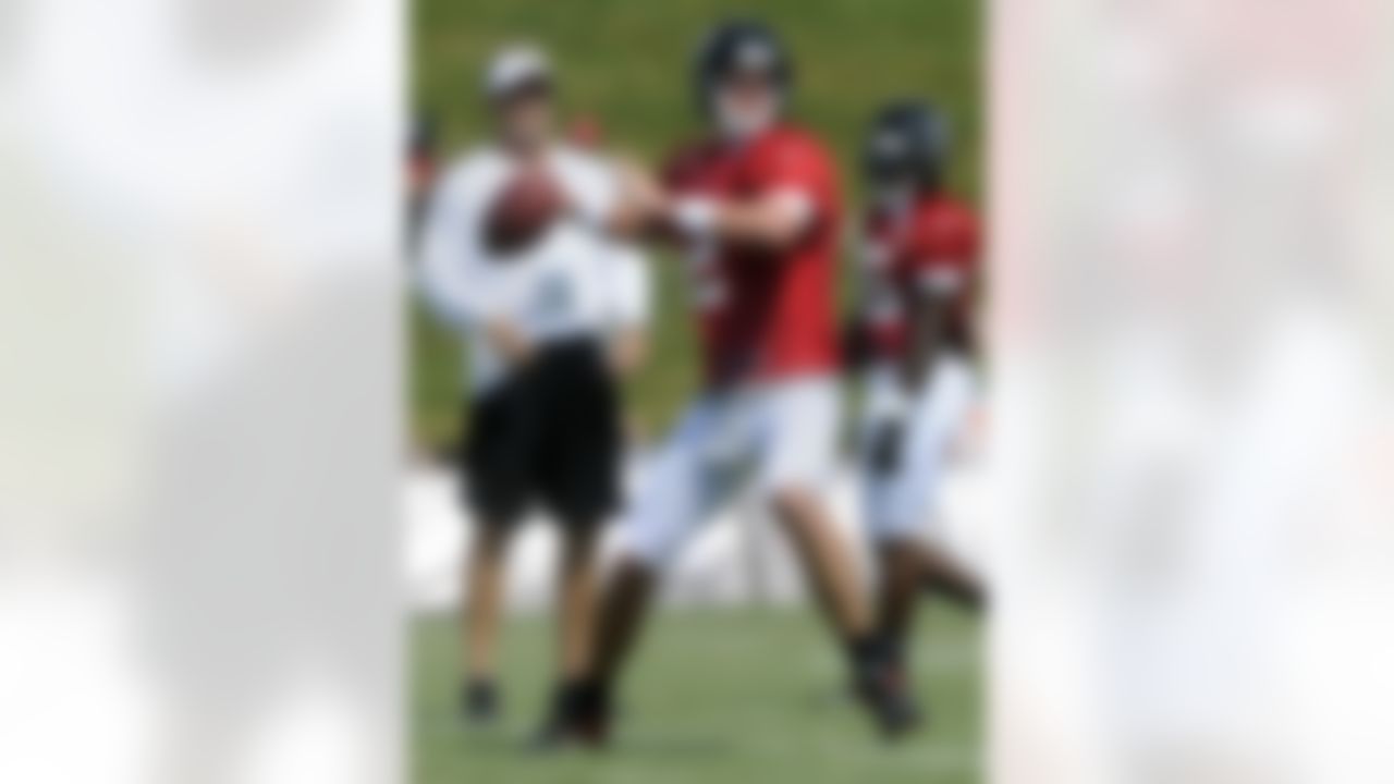Atlanta Falcons quarterback Matt Ryan works out as offensive coordinator Dirk Koetter, left, watches during NFL football training camp, Monday, July 30, 2012, in Flowery Branch, Ga. (AP Photo/John Amis)