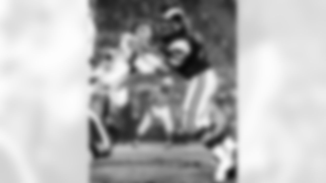 Hall of Fame defensive tackle Merlin Olsen (74) of the Los Angeles Rams in action during the Rams 24-7 preseason loss to the Dallas Cowboys on August 3, 1973 at the Los Angeles Memorial Coliseum in Los Angeles, California. (AP Photo/NFL Photos)